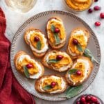 Butternut Squash Crostini with Whipped Goat Cheese, Pickled Cranberries, and Crispy Sage Recipe