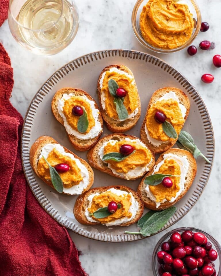 Butternut Squash Crostini with Whipped Goat Cheese, Pickled Cranberries, and Crispy Sage Recipe