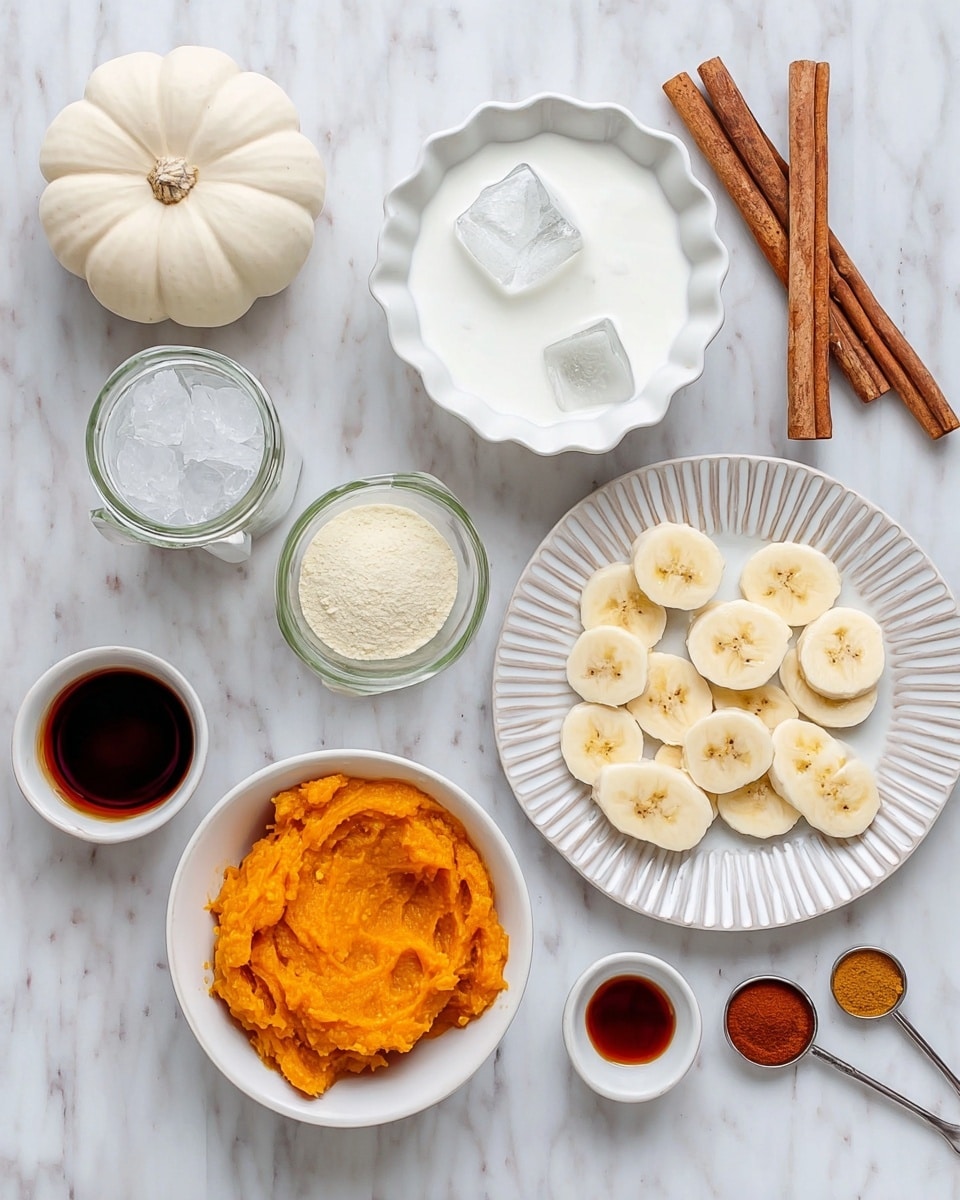 The image shows a top view of various ingredients arranged neatly on a white marbled surface. Starting from the bottom left, there's a small white bowl filled with a dark liquid, next to it is a white bowl with bright orange mashed pumpkin. Above and slightly to the right, a white bowl holds clear ice cubes, and to its right, a white plate with ridged edges displays several banana slices. Above the pumpkin, there's a white scalloped bowl filled with white creamy yogurt, next to it is a white bowl containing a pale yellow powder. To the right of this bowl is a small white bowl with a small amount of dark brown vanilla extract. In the top left corner, there is a white pumpkin alongside a glass jar full of white milk. Cinnamon sticks and spice measuring spoons with reddish-brown spices are arranged on the right side. photo taken with an iphone --ar 4:5 --v 7