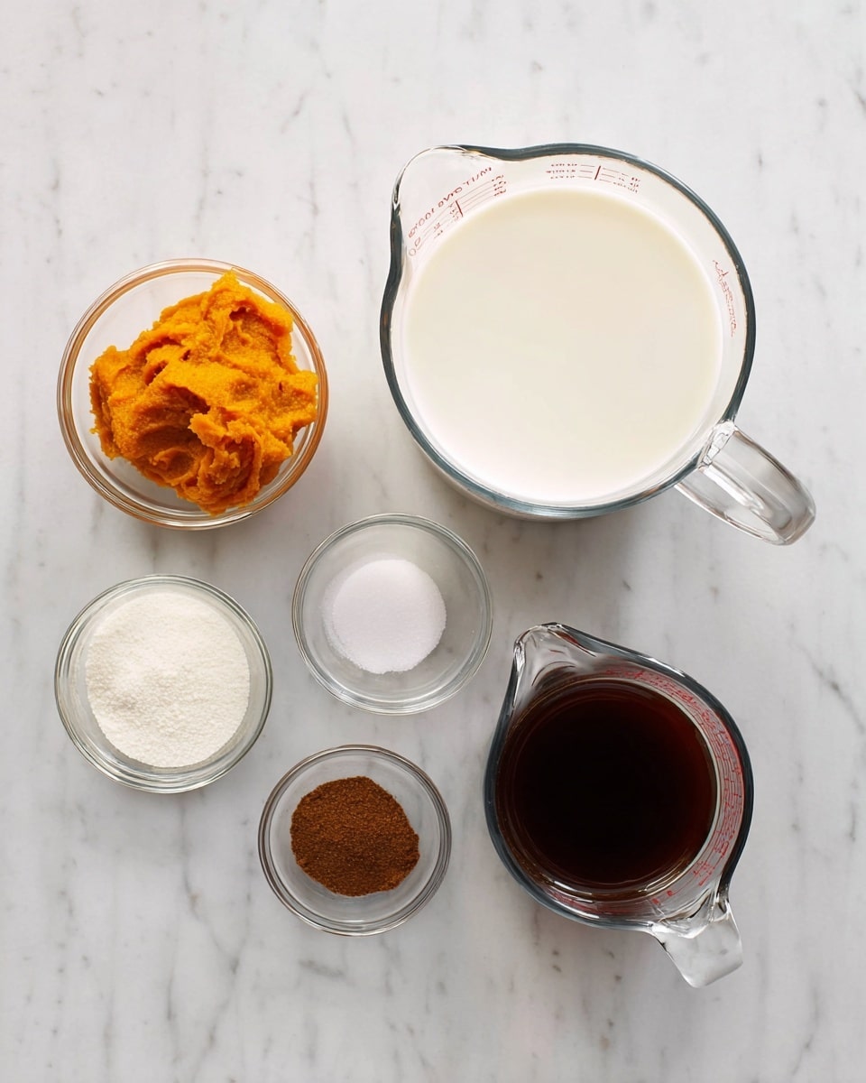 The image shows six clear glass bowls and measuring cups arranged on a white marbled surface. In the center is a large glass measuring cup filled with white milk. To the right is a glass measuring cup filled with a dark brown liquid, likely coffee or syrup. Above the milk cup is a small glass bowl with bright orange pumpkin puree. To the left of the milk are three smaller glass bowls holding white granulated sugar, a small amount of brown ground spice, and a dark brown vanilla extract. The overall setup looks clean and organized, with each ingredient clearly visible. Photo taken with an iphone --ar 4:5 --v 7