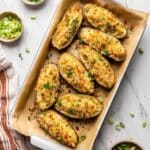 Crispy Potato Skins Loaded with Cheese, Green Onions, and Croutons Recipe