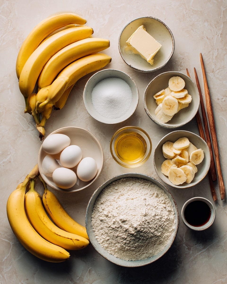The image shows a top view of various ingredients arranged neatly on a white marbled surface. There are two groups of ripe yellow bananas positioned on the left side. Nearby are several small white ceramic bowls containing ingredients: one with a thick slab of butter, one with white sugar, one with salt, one with sliced banana pieces, one with a thick creamy substance, and one with a light yellow soft solid. Three whole eggs are placed in the center area, with a clear small glass bowl holding a golden liquid next to them. A larger white bowl filled with white flour sits at the bottom right. There is also a small bowl with dark liquid and a pair of wooden chopsticks resting on it by the right edge. The setting looks clean and organized with natural light highlighting the colors and textures of the ingredients. Photo taken with an iphone --ar 4:5 --v 7