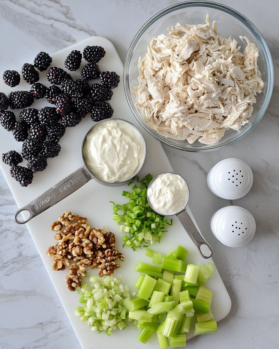 The image shows several ingredients on a white marbled surface, arranged neatly for a recipe. In the top right, there is a clear glass bowl filled with shredded light beige chicken. Below it are two metal measuring cups, one holding white cottage cheese and the other with white mayonnaise. To the left on a white cutting board, there are chopped green celery pieces, small piles of chopped green onions, and crushed light brown walnuts. Scattered blackberries, deep purple and plump, are placed near the celery and measuring cups. Two white salt and pepper shakers are positioned on the right side of the setup. The scene is bright and clean with all items clearly visible and well arranged. Photo taken with an iphone --ar 4:5 --v 7