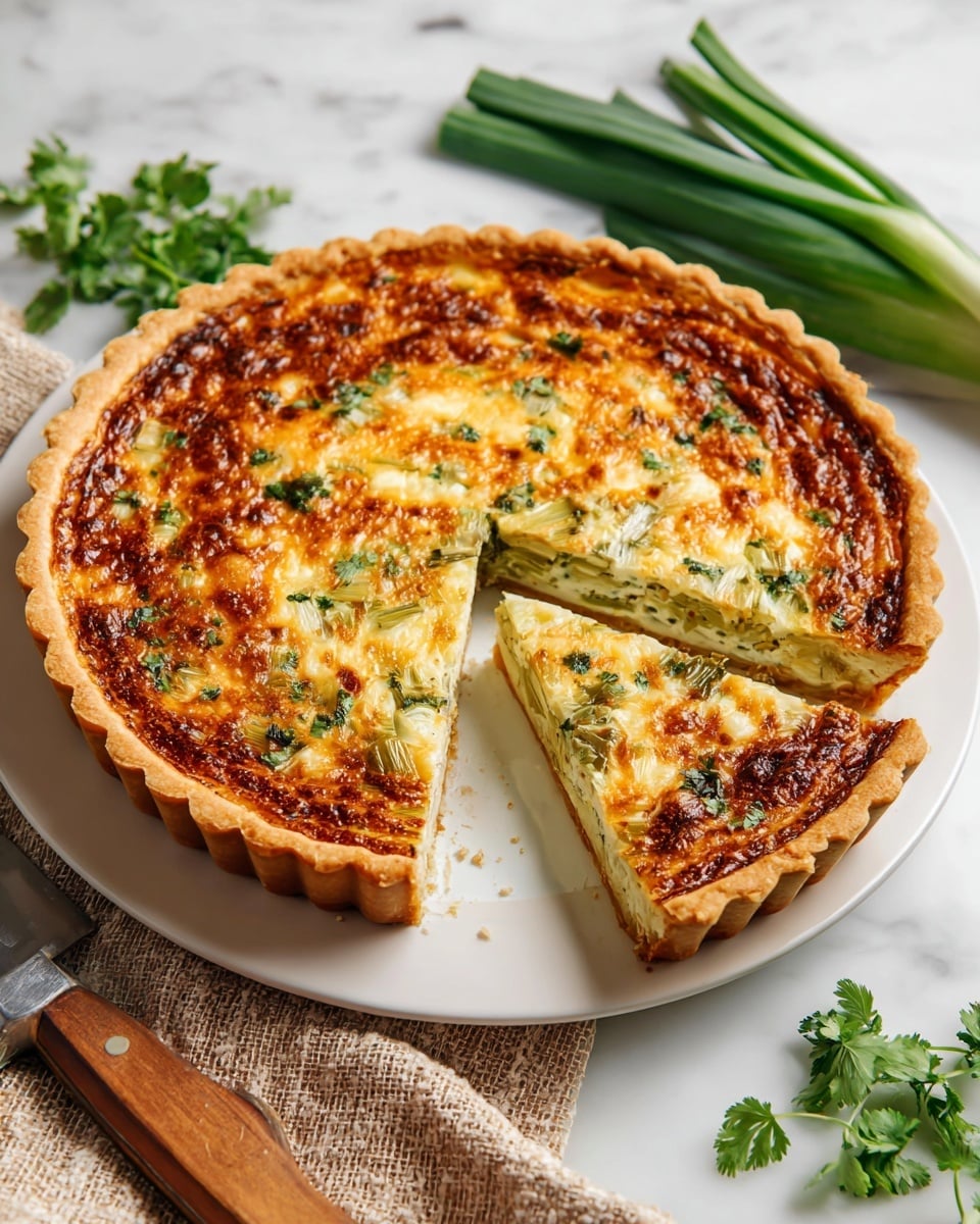 A close-up of a slice of golden brown quiche held by a woman's hand, showing three visible layers: a light, flaky crust on the bottom, a thick layer of pale green and light yellow filling with visible vegetable pieces in the middle, and a browned, slightly crispy top layer with melted cheese. Small green herb pieces are scattered on the top and around the pie in the background, which rests on a white marbled surface. Photo taken with an iphone --ar 4:5 --v 7