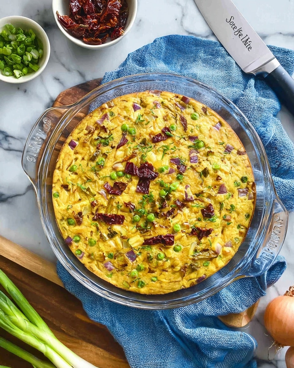 A close-up of a slice of thick, yellow savory pie lifted from a white plate. The pie has visible layers of green peas, red flecks, and chunks of potato, with bits of purple-red onion mixed throughout. The texture looks soft and dense with herbs sprinkled on top, adding green color contrast. The background shows the rest of the pie, with several triangular slices arranged in a circle on a white marbled surface. A woman's hand is partly visible holding the metal spatula under the slice. Photo taken with an iphone --ar 4:5 --v 7