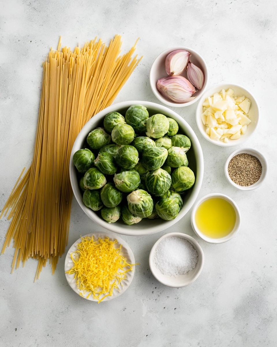 The image shows an overhead view of raw ingredients arranged on a white marbled surface. At the center is a white bowl filled with fresh, green Brussels sprouts. To the left, there is a bunch of dry uncooked spaghetti neatly spread out. Surrounding the bowl are smaller white bowls with various ingredients: one contains thinly sliced shallots, another has grated Parmesan cheese, and a third has minced garlic. Nearby, there is a small pile of bright yellow lemon zest on the white marbled surface. To the right, there are three small white bowls holding olive oil, lemon juice, and a mix of salt and pepper. The composition looks clean and organized, with natural light highlighting the fresh colors of the produce and ingredients. Photo taken with an iphone --ar 4:5 --v 7