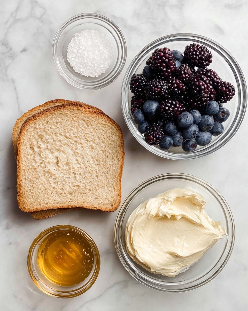 Two slices of light brown bread are placed on a white marbled surface. To the right of the bread, there is a clear glass bowl filled with dark purple blackberries and blue blueberries. Above the bread is a small clear glass bowl with white coarse salt. Below the salt bowl and to the left of the berries, there is a clear glass bowl with a light cream-colored spread that looks smooth and soft. To the right of that is a small clear glass bowl filled with golden honey. photo taken with an iphone --ar 4:5 --v 7