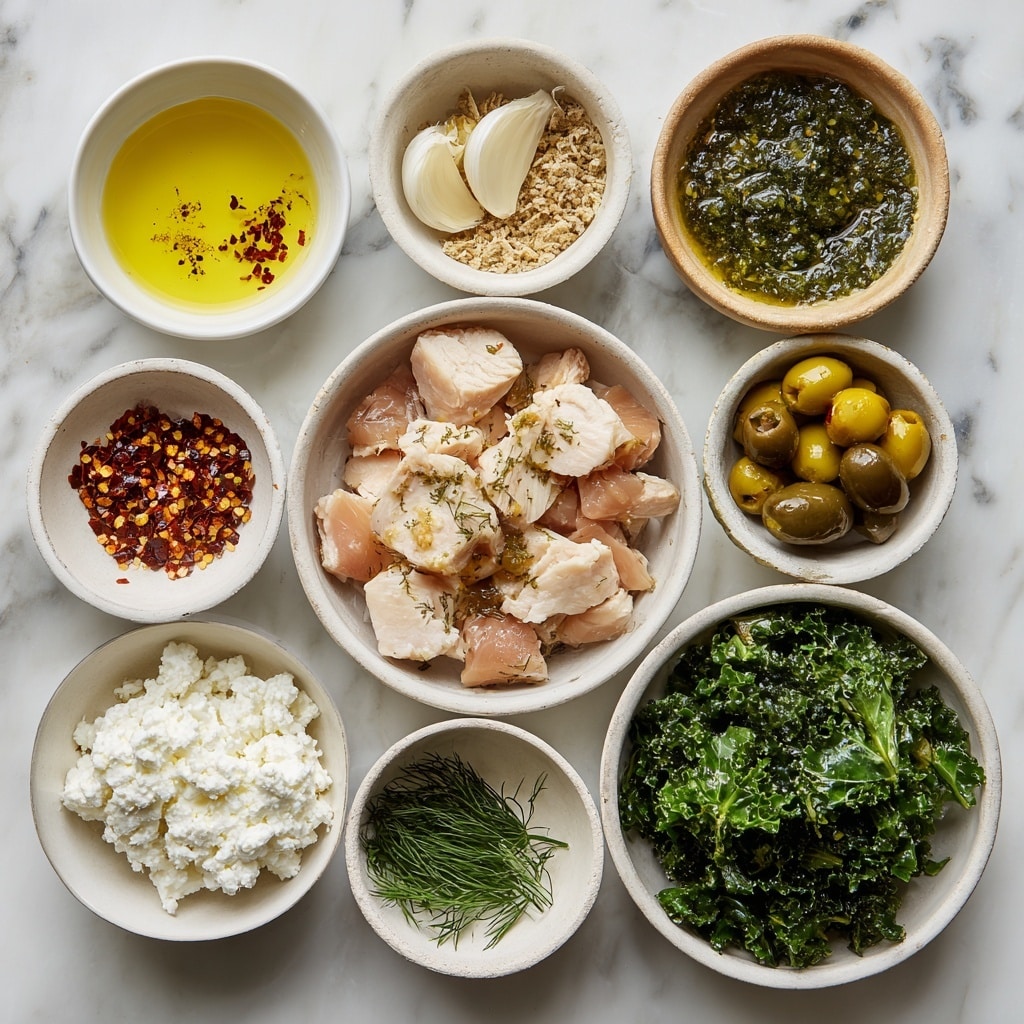 The image shows a white bowl filled with three main layers: on the right side is a layer of plain white rice with a soft texture, topped with golden-brown grilled chicken cubes that have a lightly charred surface; on the left side is a layer of fresh dark green kale, mixed with sliced black and green olives; a creamy beige sauce is drizzled over both the chicken and kale layers, with some small white cheese crumbles sprinkled on top; fresh dill sprigs add a bright green garnish mainly over the kale; the bowl sits on a white marbled surface with soft natural lighting, photo taken with an iphone --ar 4:5 --v 7
