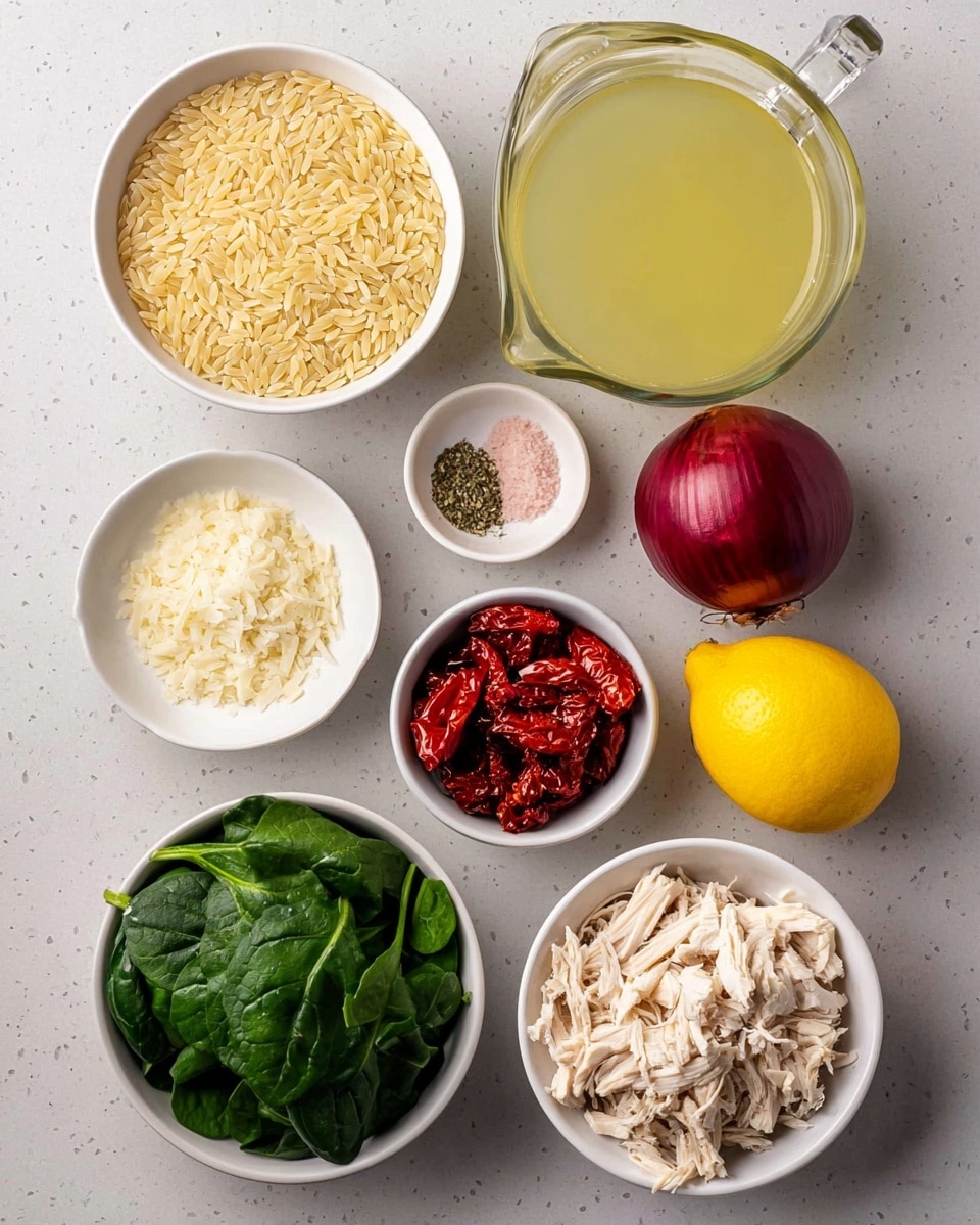 The image shows several small white bowls and some whole ingredients arranged on a flat white marbled surface. In the top left, one white bowl is filled with pale yellow orzo pasta grains. To the right is a glass measuring cup filled with light yellow broth. Below the orzo is a small white bowl containing pink salt and dried herbs, next to three whole garlic cloves. To the right of these is a shiny red onion and below it a bright yellow lemon. In the center, a white bowl holds dark green fresh spinach leaves. Below the spinach is a white bowl filled with dark red sun-dried tomatoes, next to another white bowl holding white crumbly cheese. At the bottom right, a white bowl contains shredded pale cooked chicken. photo taken with an iphone --ar 4:5 --v 7
