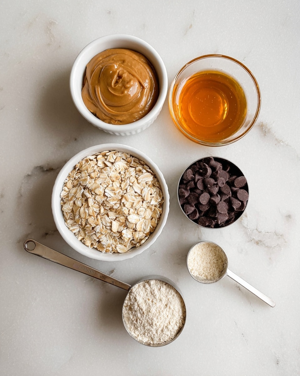 The image shows five ingredients placed on a white marbled surface in a neat arrangement. At the top left, there is a white ramekin filled with smooth, light brown peanut butter. To its right, a clear small glass bowl holds golden amber honey with a shiny texture. Below the peanut butter, another white ramekin is filled with pale beige rolled oats that have a rough texture. Next to the oats, a silver measuring cup with a white handle contains dark chocolate chips in small round shapes. Finally, at the bottom right, a slightly smaller silver measuring cup with a white handle holds a light, pale cream-colored powder. photo taken with an iphone --ar 4:5 --v 7