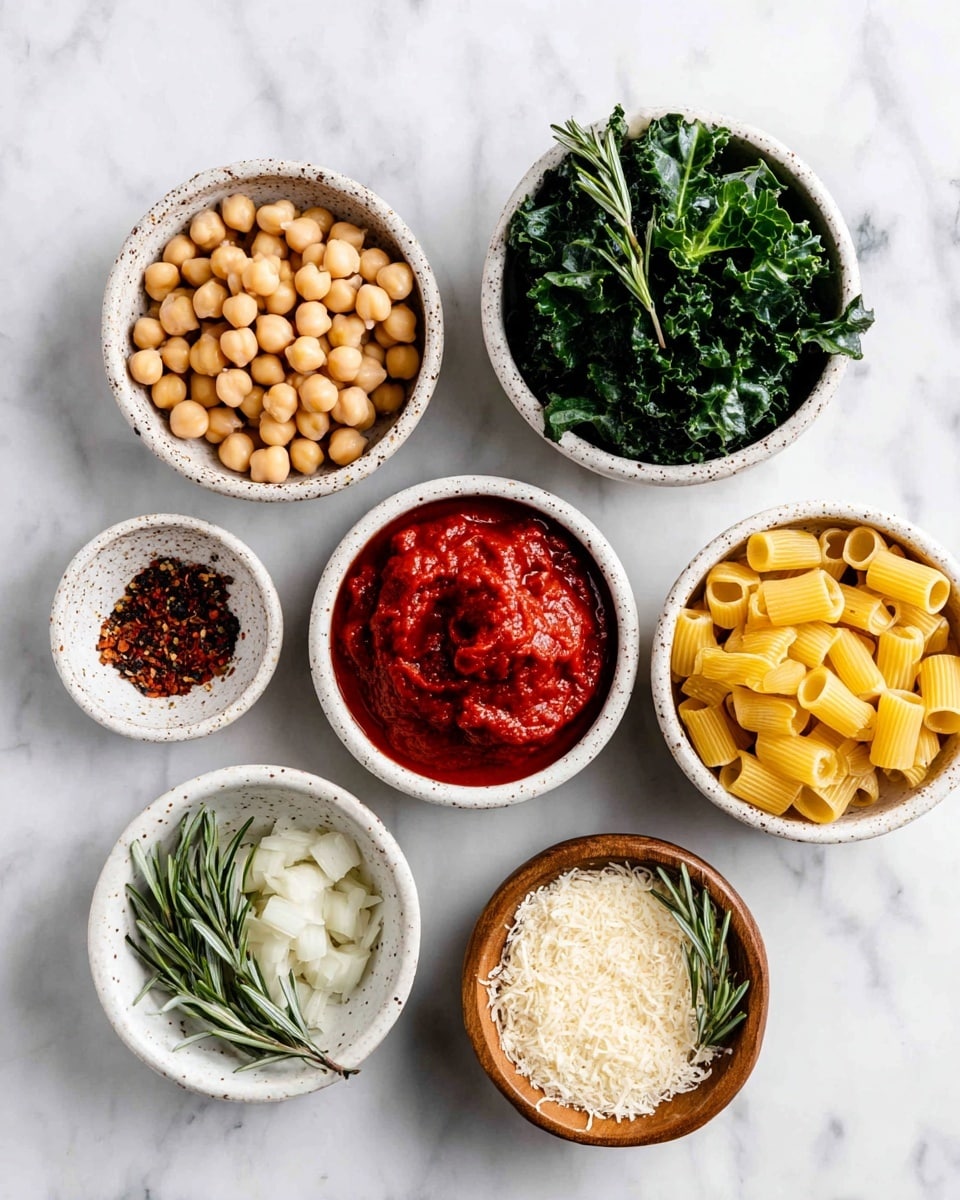 The image shows a white marbled surface with eight small bowls arranged in a loose circular pattern. At the top center is a speckled white bowl holding bright red tomato paste with a smooth, thick texture. To its right is a tiny speckled white bowl filled with small dark red chili flakes, sitting next to two sprigs of fresh green rosemary. Below the chili flakes is a small bowl containing finely chopped white onion pieces. On the bottom right is a small wooden bowl with pale grated pecorino cheese that has a fine texture. To the left of the pecorino bowl is a larger white speckled bowl filled with round beige chickpeas. Above the chickpeas bowl is a green bowl packed with fresh, dark green curly leafy greens. Finally, to the left of the tomato paste is another white bowl containing short yellow pasta tubes with a smooth surface. All bowls are neatly placed against the white marbled background. Photo taken with an iphone --ar 4:5 --v 7