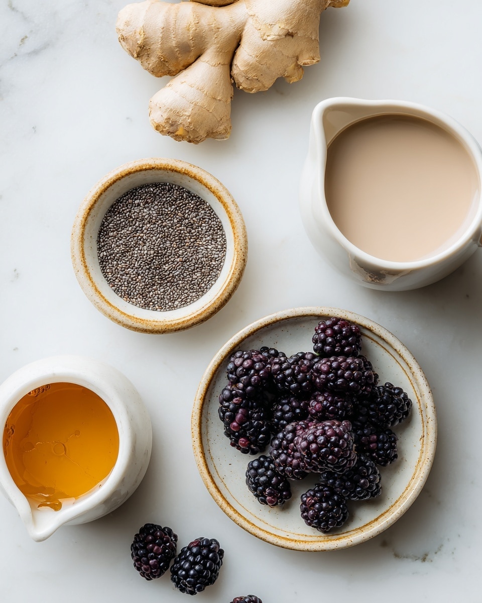 The image shows a white marbled surface with several ingredients arranged neatly. At the top left is a piece of light tan root ginger. Below that is a small round bowl with a light beige inside and a light brown rim, filled with small black chia seeds. Centered is another round bowl with a similar beige and brown design, filled with plump, dark purple-black blackberries, with a few blackberries scattered beside it. At the top right is a white small pitcher filled with light brown plant milk, and near the bottom left is a small white pitcher with amber maple syrup inside. The scene is clean and bright, with simple and natural tones. photo taken with an iphone --ar 4:5 --v 7