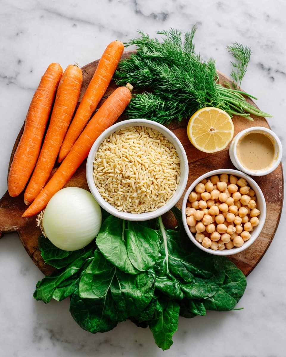 A round wooden board sits on a white marbled surface, holding fresh ingredients: three long orange carrots on the left, a half white onion below them, and green leafy vegetables spread out on the bottom and right side. Near the center, a small white bowl filled with light yellow orzo pasta sits above the leaves. To the right, a larger white bowl filled with light beige chickpeas sits on top of the greens. At the top center, two lemon halves and one whole yellow lemon rest next to a small bunch of fresh green dill. A small white bowl with light beige tahini sauce is at the top right of the board. Photo taken with an iphone --ar 4:5 --v 7