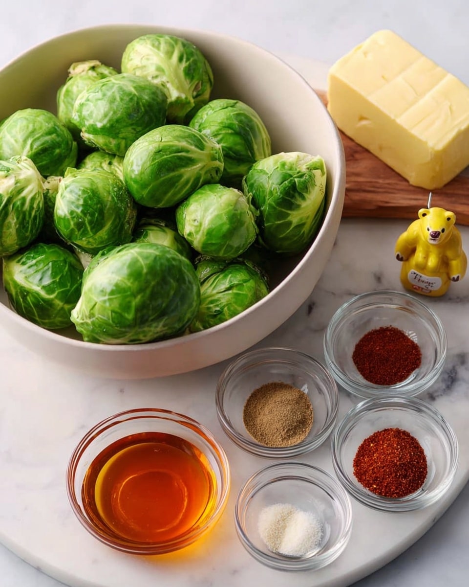 A white bowl full of fresh bright green Brussels sprouts with tight leaves is placed on the left side of a white marbled surface. On the right side, there is a round white marble board holding ingredients arranged neatly: a block of pale yellow butter near the top, a small honey bear bottle with a yellow cap behind it, and five small clear glass bowls around them containing different spices in shades of red, brown, and white, along with a small bowl of amber honey in the center. The colors are fresh and natural with a clean, soft light. Photo taken with an iphone --ar 4:5 --v 7