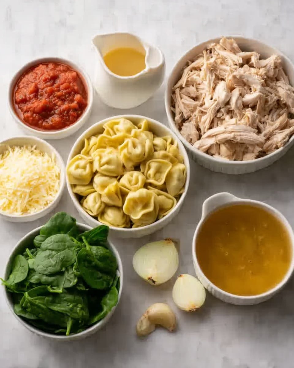The image shows several small white bowls and a larger white bowl arranged on a white marbled surface. In the large bowl, shredded light-colored cooked chicken fills the space. One white bowl contains yellow tortellini pasta, another holds a bright red chunky sauce, and a smaller bowl has less tortellini. There is a bowl of fresh green spinach leaves and a bowl with light yellow grated cheese. A small white pitcher holds cream next to a glass filled with golden broth. A halved yellow onion and three garlic cloves rest on the surface nearby, all lit with natural soft light. Photo taken with an iphone --ar 4:5 --v 7