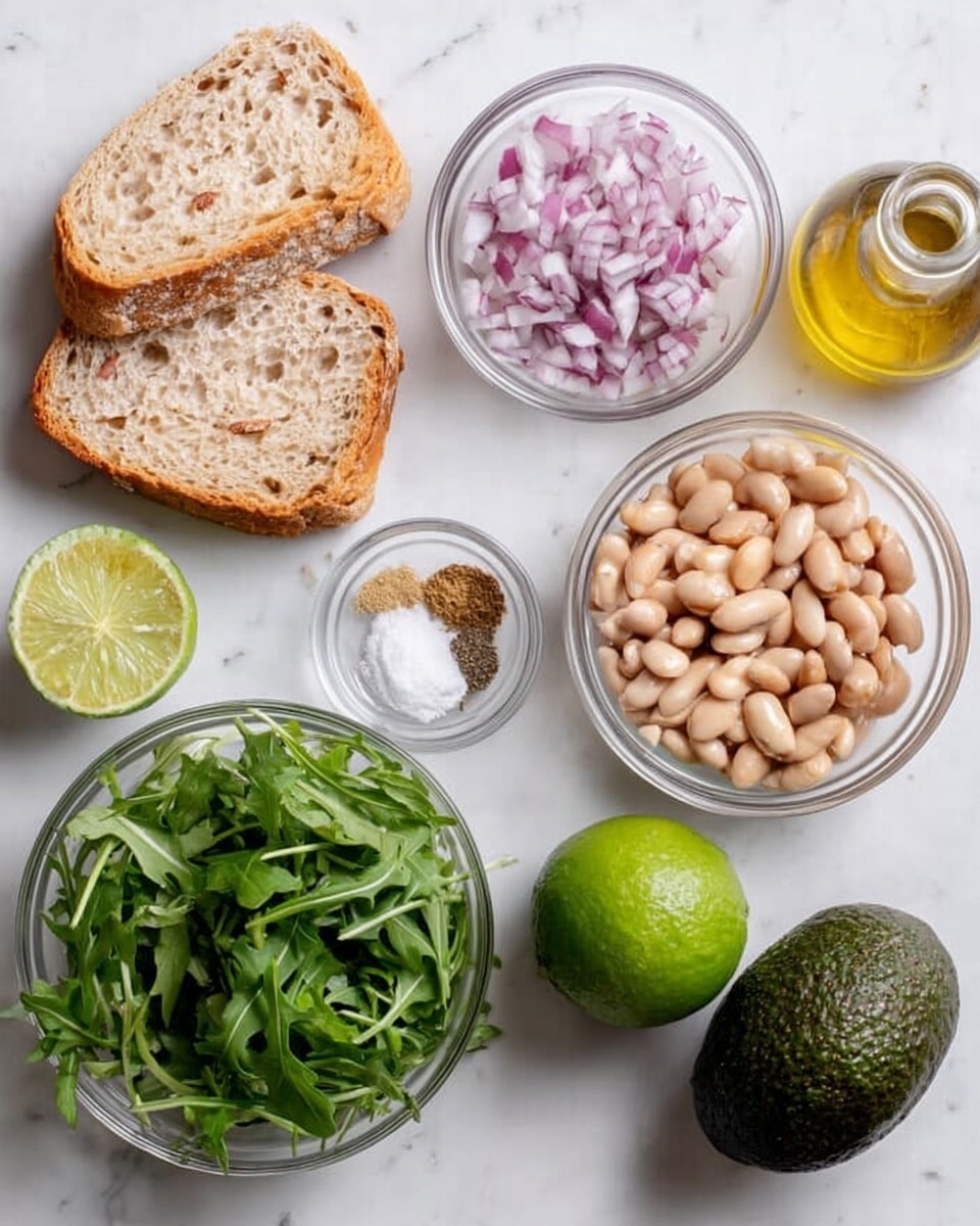 The image shows ingredients neatly placed on a white marbled surface, including two slices of light brown bread with visible grains, a whole green lime, a dark green avocado with rough skin, a small glass bowl of finely chopped purple onions, a larger glass bowl filled with fresh green arugula leaves, a medium glass bowl full of pale beige beans, and a small glass bowl holding salt, black pepper, and a light brown powdered spice. There is also a clear glass bottle with golden oil. Everything is arranged in a flat lay style from above, highlighting the natural colors and textures of each ingredient photo taken with an iphone --ar 4:5 --v 7