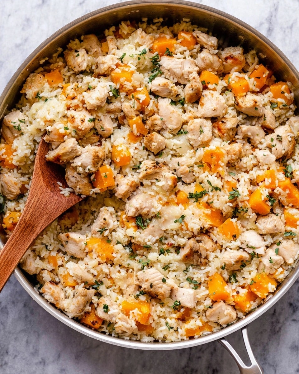 The image shows a close-up of a white bowl filled with a creamy dish made of small, light beige rice or grain pieces mixed with orange chunks, likely squash or pumpkin, and small pieces of light-colored meat. The grains look soft and creamy with melted cheese strands stretching between a spoon and the bowl. Herbs in small green bits are scattered throughout the dish. A woman's hand holds the spoon lifting a portion of the food, creating a warm and inviting feeling. The bowl rests on a white marbled surface. photo taken with an iphone --ar 4:5 --v 7