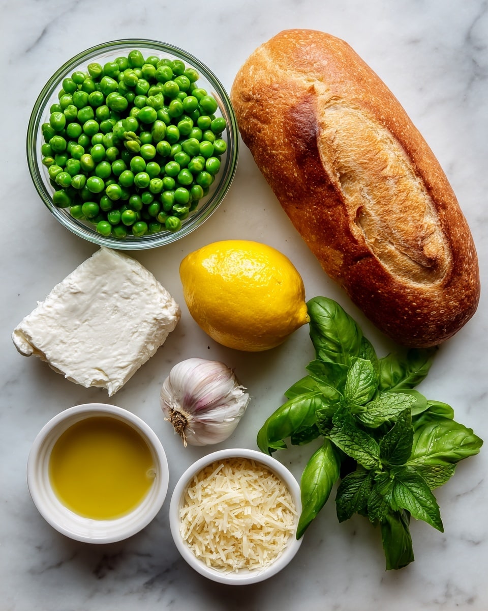 A top view of ingredients arranged neatly on a white marbled surface for making pea pesto bruschetta, including a small clear glass bowl filled with bright green frozen peas on the top left, and a golden brown crusty loaf of bread placed to the top right. Below the peas and bread, a bright yellow lemon sits in the center, flanked by fresh green basil leaves on the right and a small fresh mint sprig in the lower right corner. Near the lemon is a single clove of garlic. On the bottom left, a small white bowl holds a white block of goat’s cheese while next to it a small clear glass bowl is filled with golden olive oil. To the right of olive oil, another small white bowl contains finely grated pale yellow Parmigiano Reggiano cheese. The items are spaced evenly, showing different vibrant colors and textures against the white marbled background photo taken with an iphone --ar 4:5 --v 7