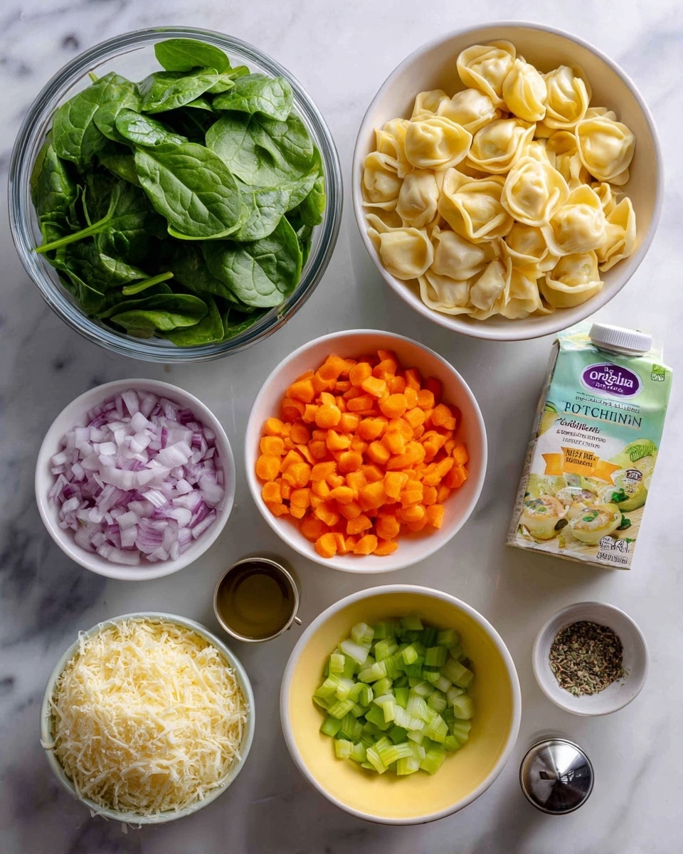 The image shows several ingredients arranged neatly on a white marbled surface. There is a clear plastic container filled with fresh green baby spinach leaves in the top left. Next to it, a white bowl holds pale yellow cheese tortellini. On the right, a carton of organic no chicken broth stands upright beside a small silver cup of salt. Below, there is a white bowl with bright orange chopped carrots, a tiny yellow bowl with chopped green parsley or scallions, and a small white bowl filled with finely grated pale yellow parmesan cheese. A white bowl with chopped light purple onions is near the center, next to a glass container of olive oil and a small cup of black pepper. At the lower left, a small white bowl holds diced celery with a green hue. The ingredients are arranged in a clean, orderly way. photo taken with an iphone --ar 4:5 --v 7