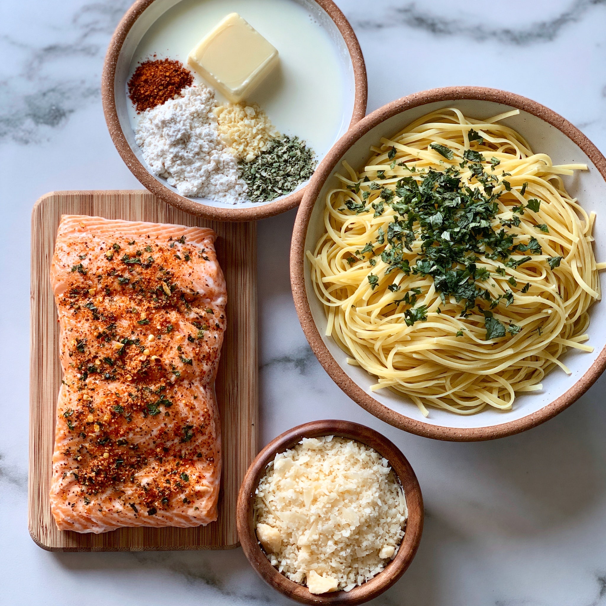 A bowl filled with cooked spaghetti pasta mixed with chunks of light pink fish and creamy white sauce, scattered with small fresh green basil leaves on top. The bowl is white with a detailed dark brown pattern along the inside rim. The dish is placed on a white marbled surface with a woven mat underneath. photo taken with an iphone --ar 4:5 --v 7