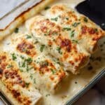Shredded Chicken Enchiladas with Cheesy Sour Cream Sauce Recipe