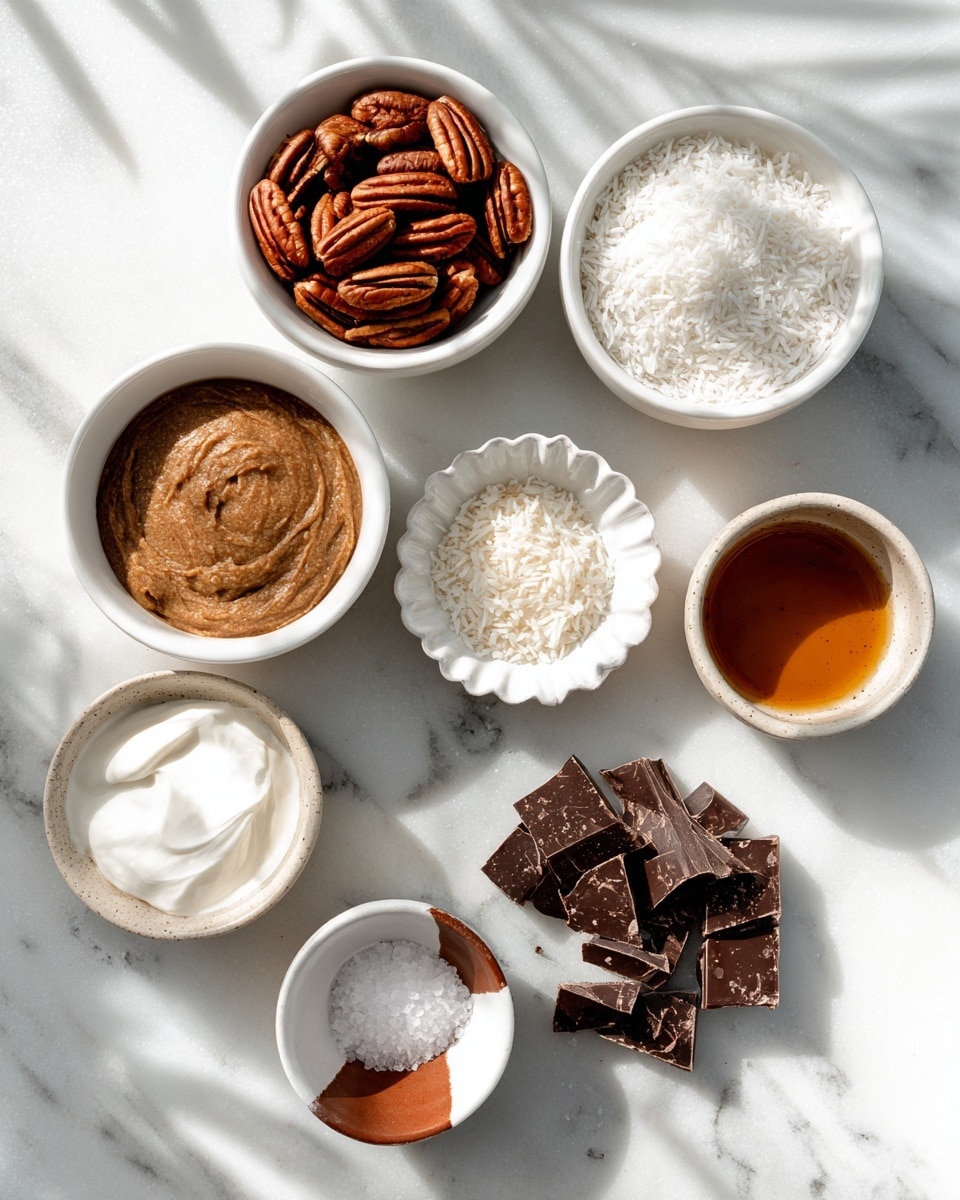 The image shows seven small white bowls arranged on a white marbled surface with sunlight casting soft shadows. Each bowl contains a different ingredient: the top left bowl is filled with whole brown pecans, the top right bowl holds fine white shredded coconut. Below those, a white measuring cup is filled with smooth brown almond butter on the left, and a small white scalloped bowl with a tiny heap of salt is to the right. The bottom left bowl contains thick, white coconut cream with a smooth texture, while the bottom right bowl has irregular dark chocolate chunks. Lastly, a small two-toned white and brown bowl holds a rich amber liquid labeled vanilla. The photo taken with an iphone --ar 4:5 --v 7